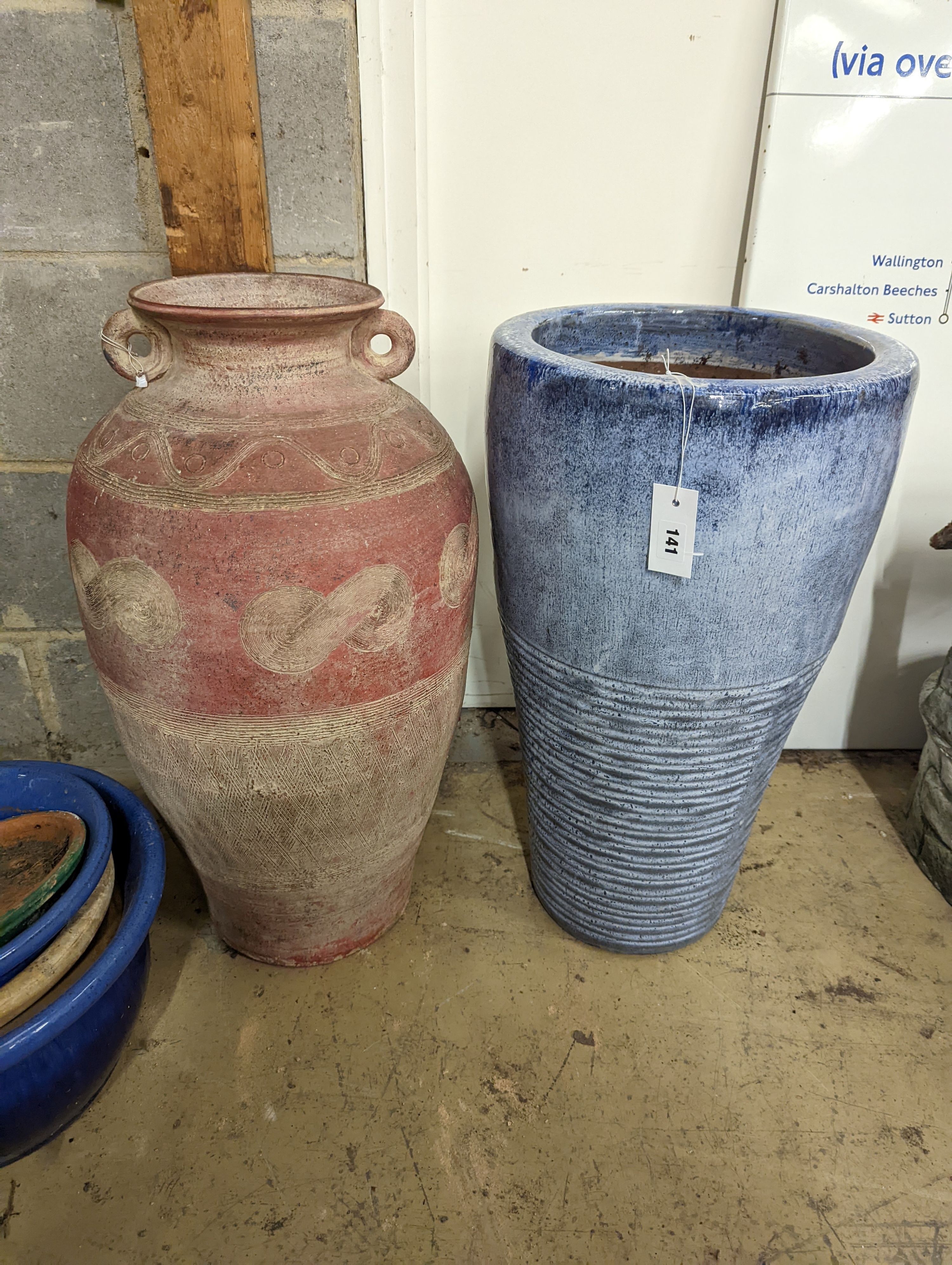 Two glazed earthenware garden planters, largest height 66cm